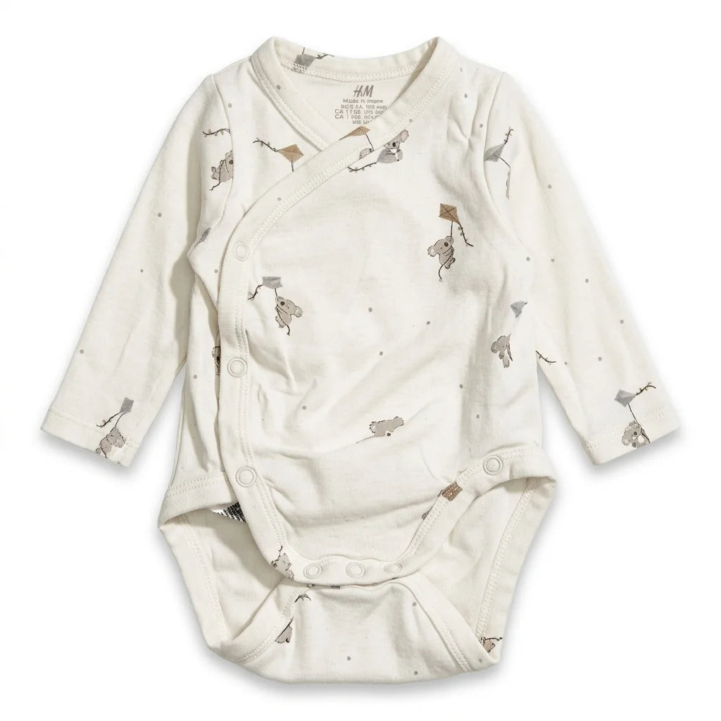 Djurmönstrad body från H&M - Storlek 62/68 - Vit