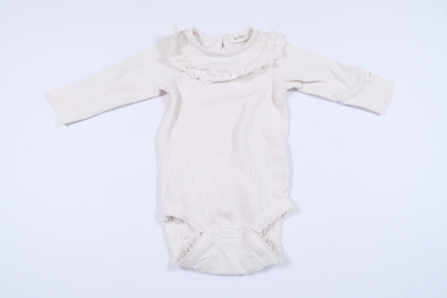 White long-sleeved bodysuit with lace detail from Newbie in size 56