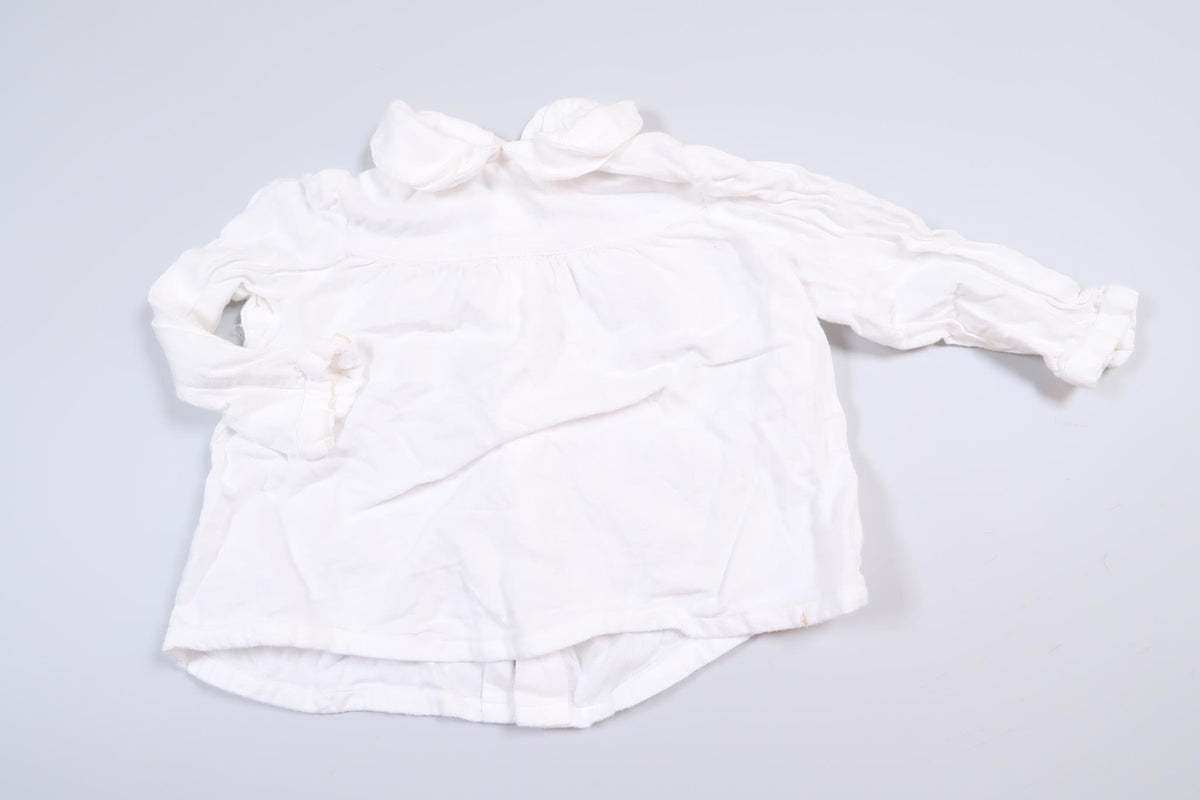 White long-sleeved blouse from Zara in size 68
