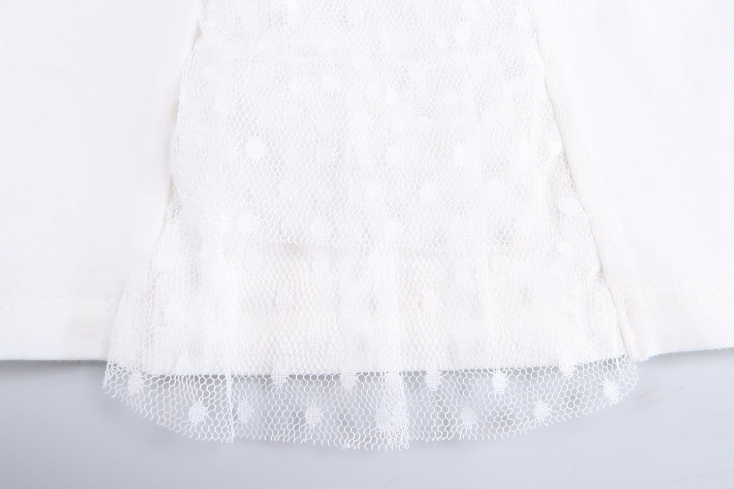 White long-sleeved sweater with pearls and lace details from Ebito in size 68