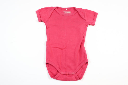 Pink short-sleeved bodysuit from Name It in size 62