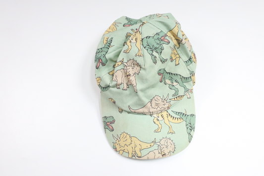 Cap with dinosaurs from Lindex - Size 116/122 - Green
