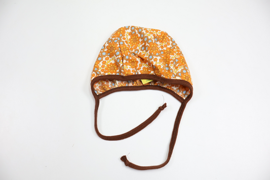 Blommig hjälmmössa från Bonkelimini - Storlek 62/68 - Orange