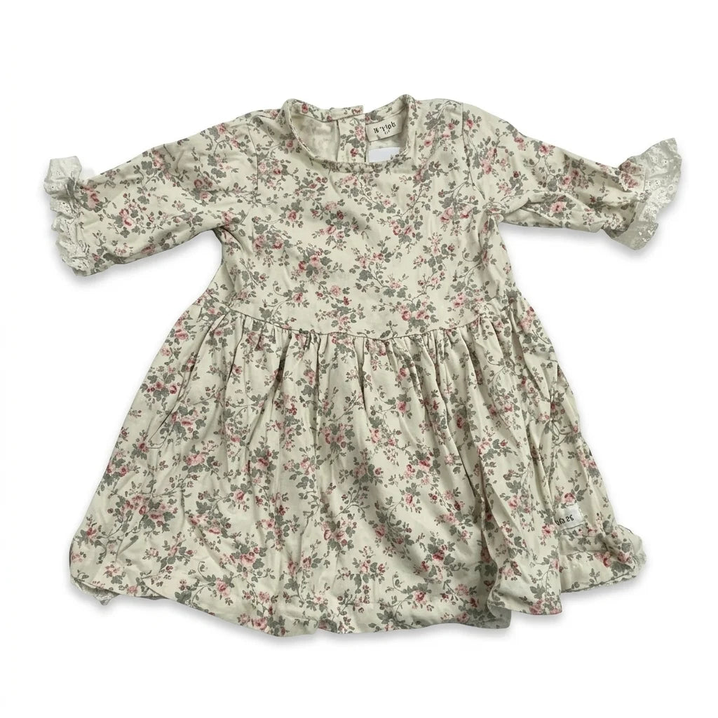 Blommig klänning från Newbie - Storlek 80 - Benvit